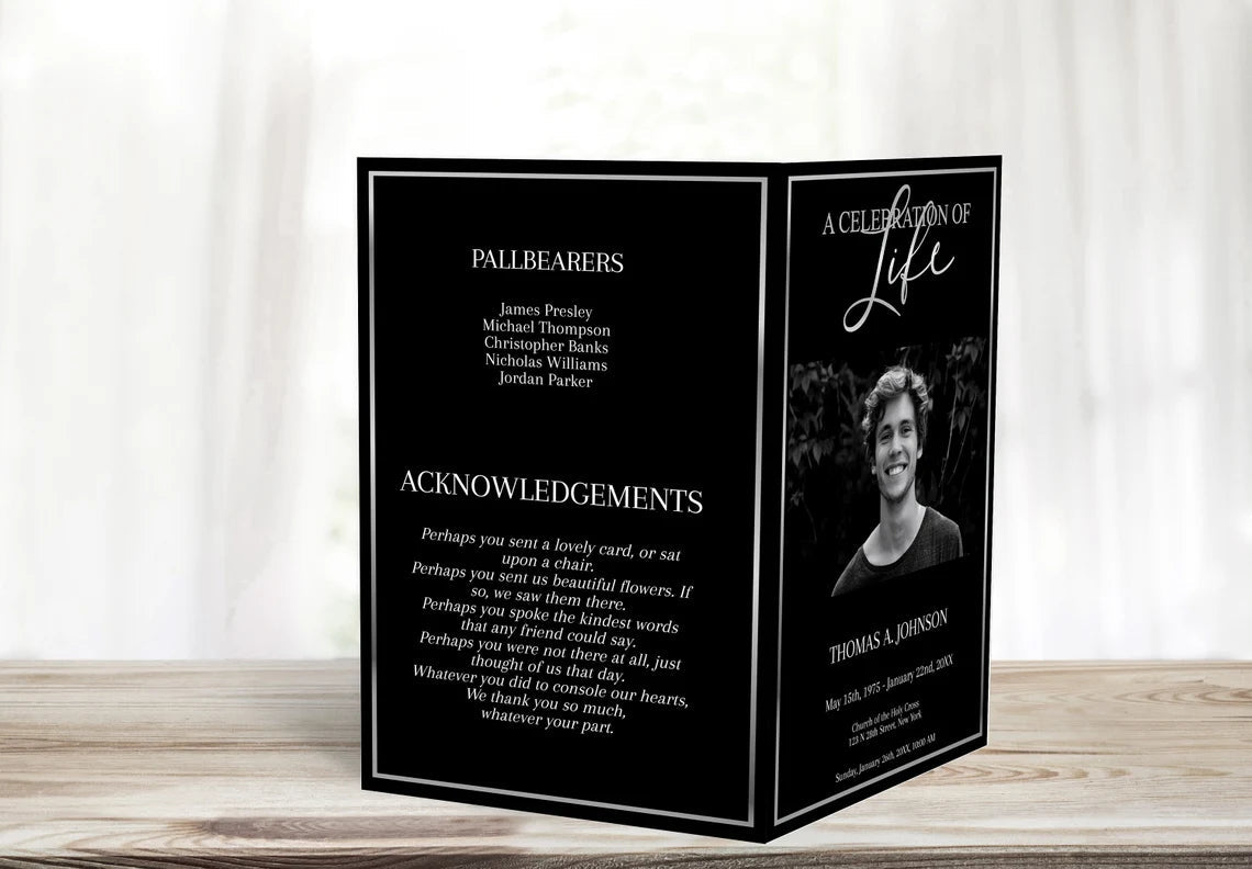 black and silver funeral program template on display