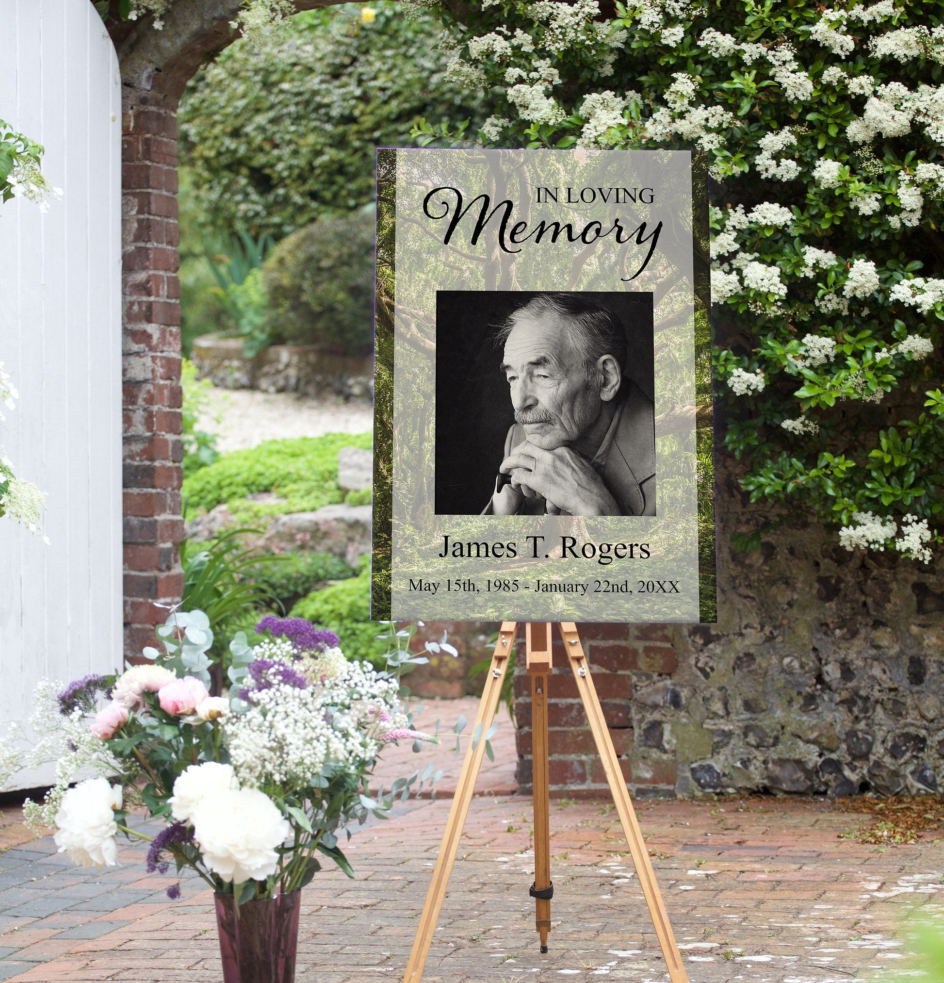 editable funeral poster template on display next to flowers