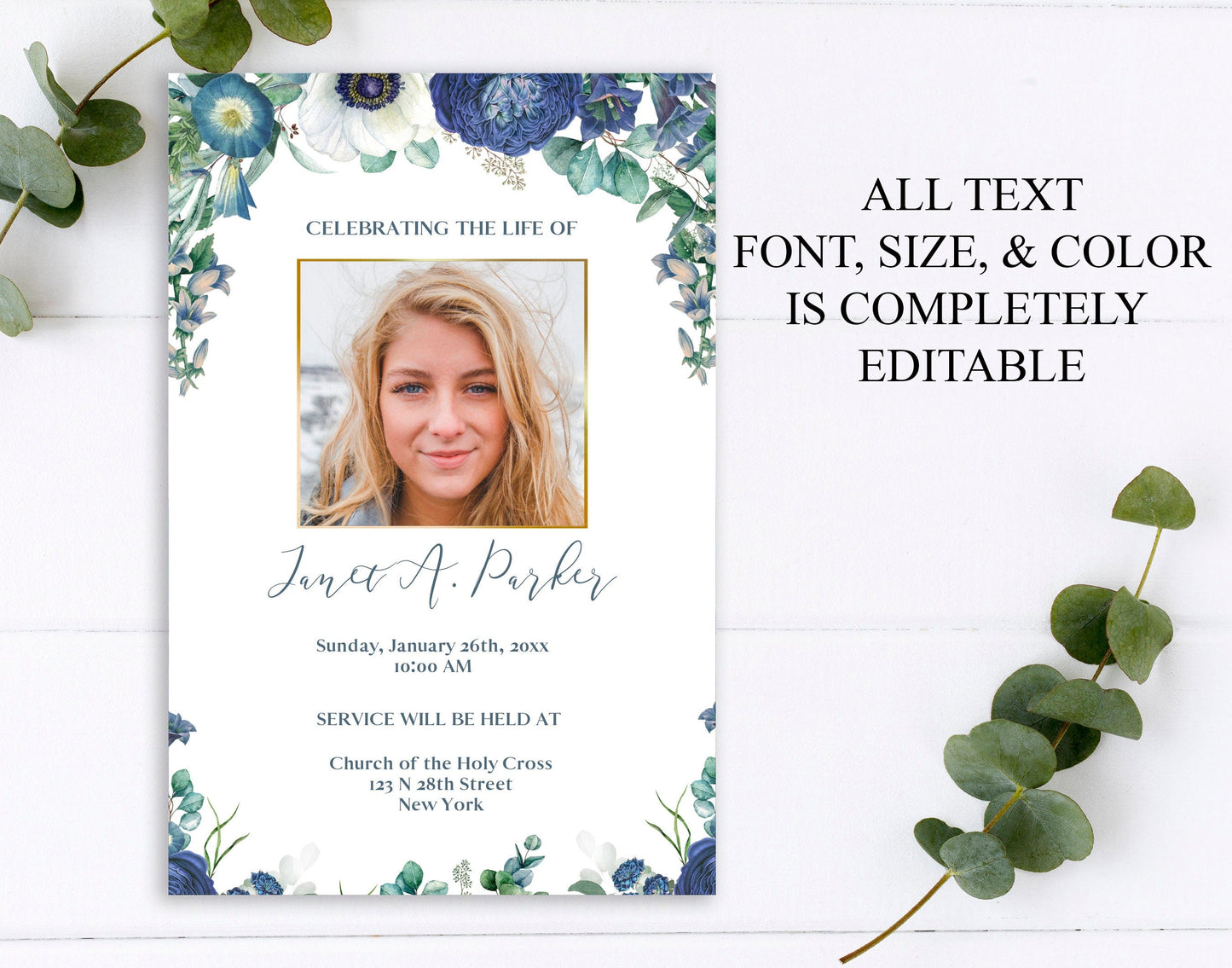 Blue flowers and greenery on the front of a funeral invitation template with large center photo