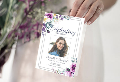 Purple and white flowers with a grey border on this funeral program example
