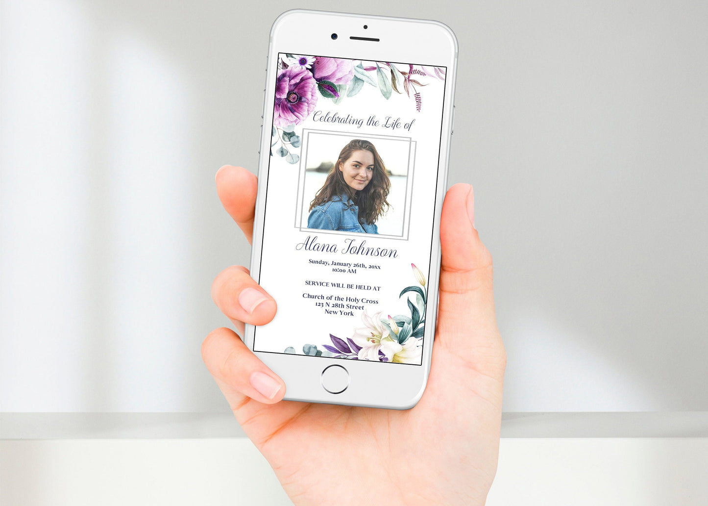 Elegant purple flowers adorn this funeral announcement template on a phone